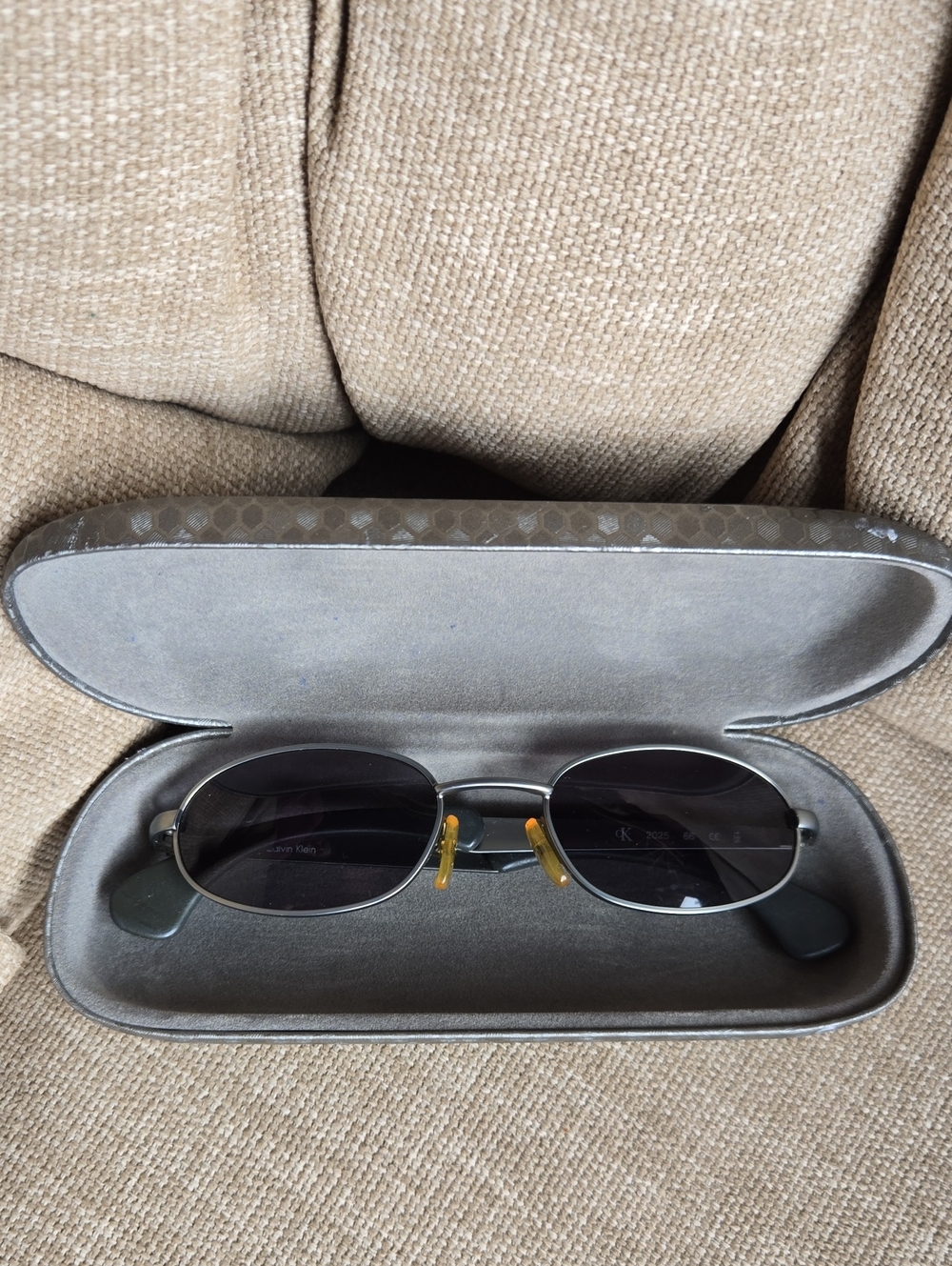 Calvin Klein Men’s Black Sunglasses with Silver Frame and Yellow Nose Pads